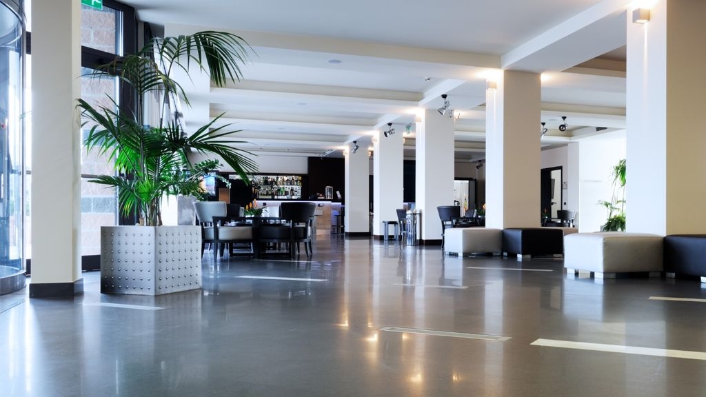 A empty hotel reception and dining area
